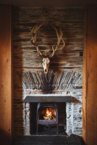 A fireplace at Fforest Farm